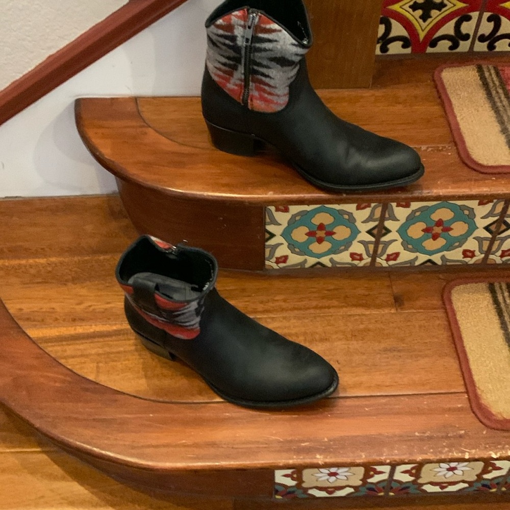 Striking short western bootie with southwestern wool accent tops